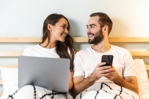 Couple creates a collaborative photo album in bed